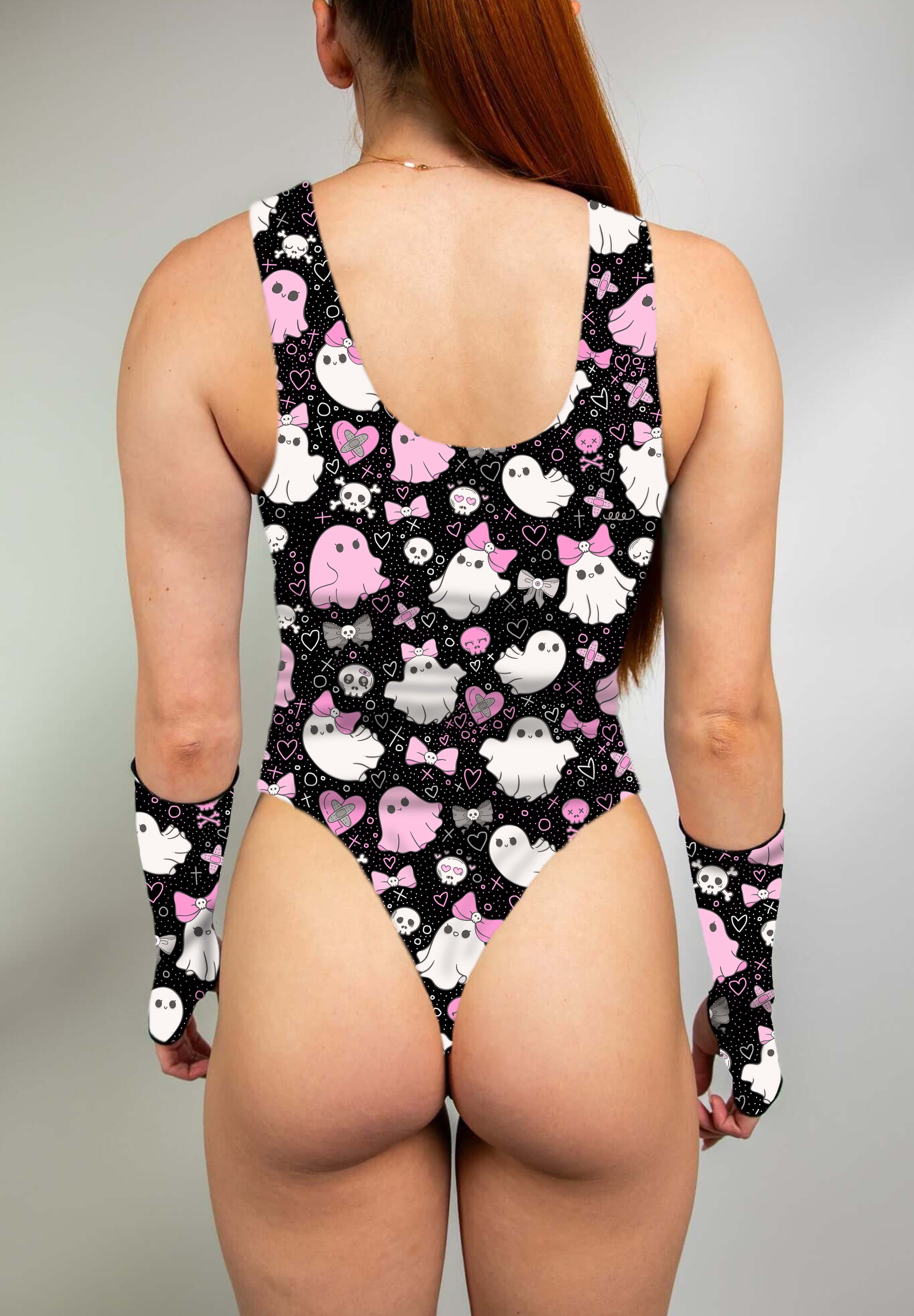 Model wearing keyhole bodysuit with pink and white spooky ghost print and matching gloves.