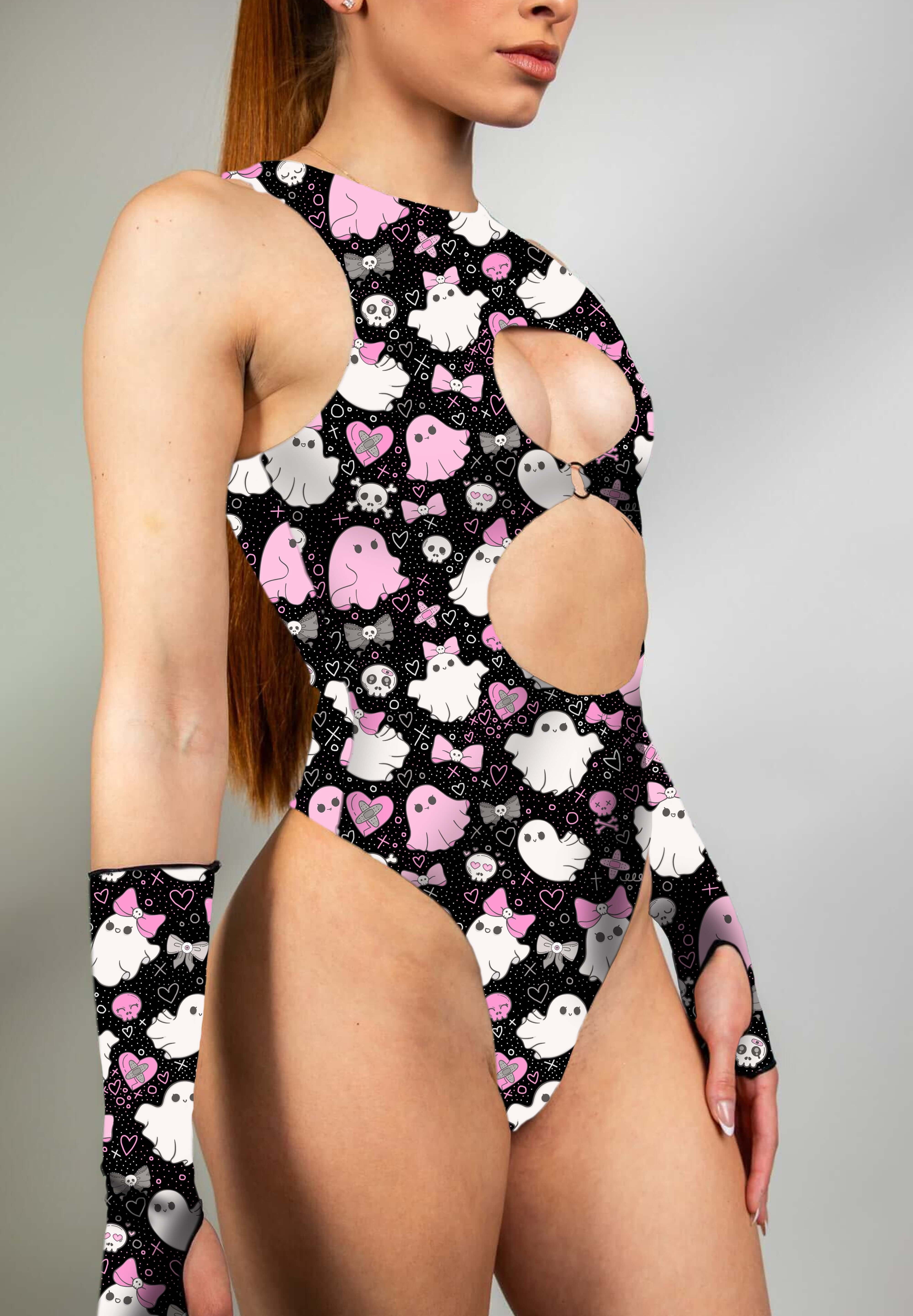 Model wearing keyhole bodysuit with pink and white spooky ghost print and matching gloves.