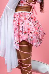 Delicate pink cherry blossom skirt featuring a layered design, perfect for rave outfits and feminine spring styles.