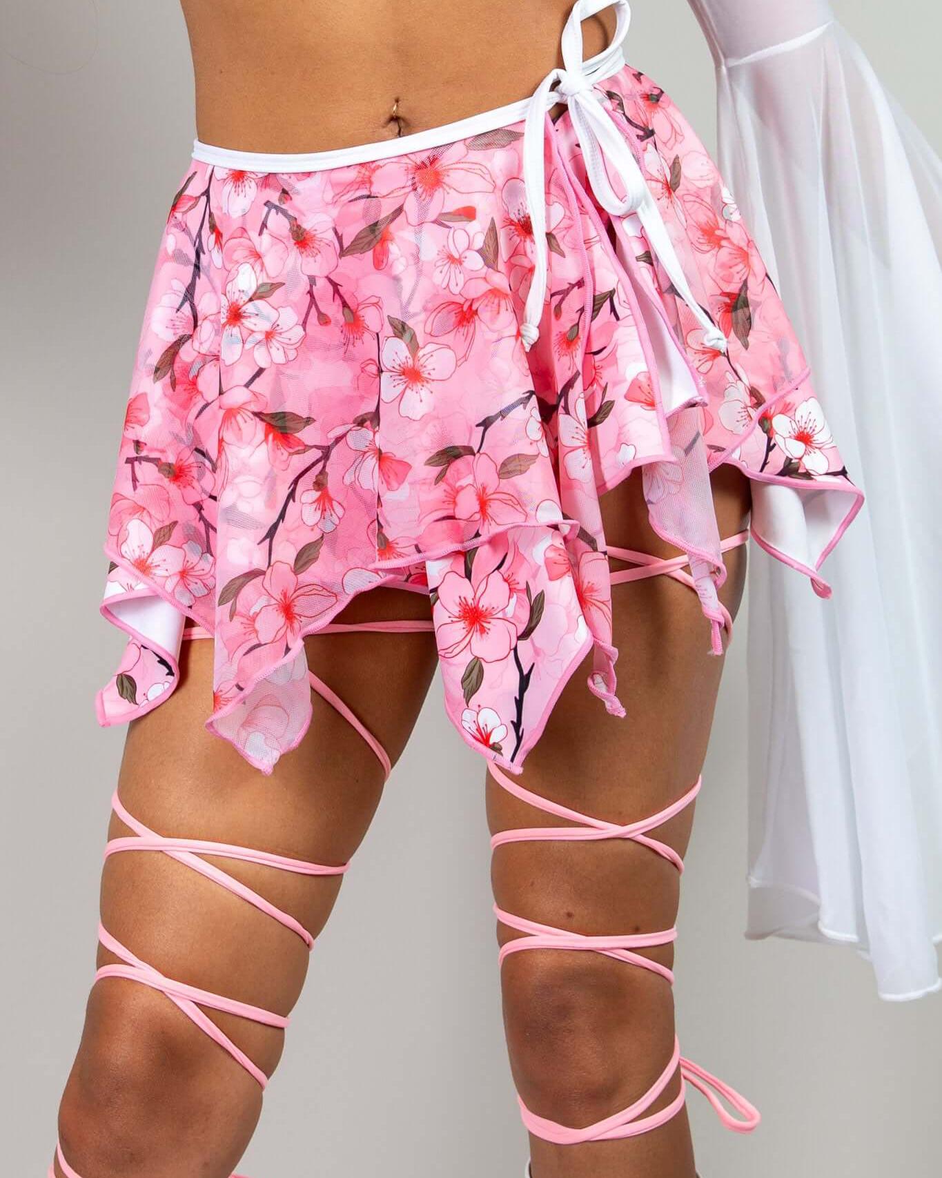 Sakura Fairy Skirt with pink cherry blossom print, perfect for rave outfits and playful spring looks.