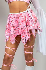 Sakura Fairy Skirt with pink cherry blossom print, perfect for rave outfits and playful spring looks.