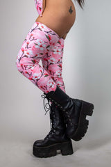 Sakura leg sleeves with pink cherry blossom design paired with black platform boots, perfect for rave outfits.