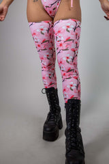 Sakura leg sleeves with pink cherry blossom design, perfect for rave outfits, paired with black combat boots.