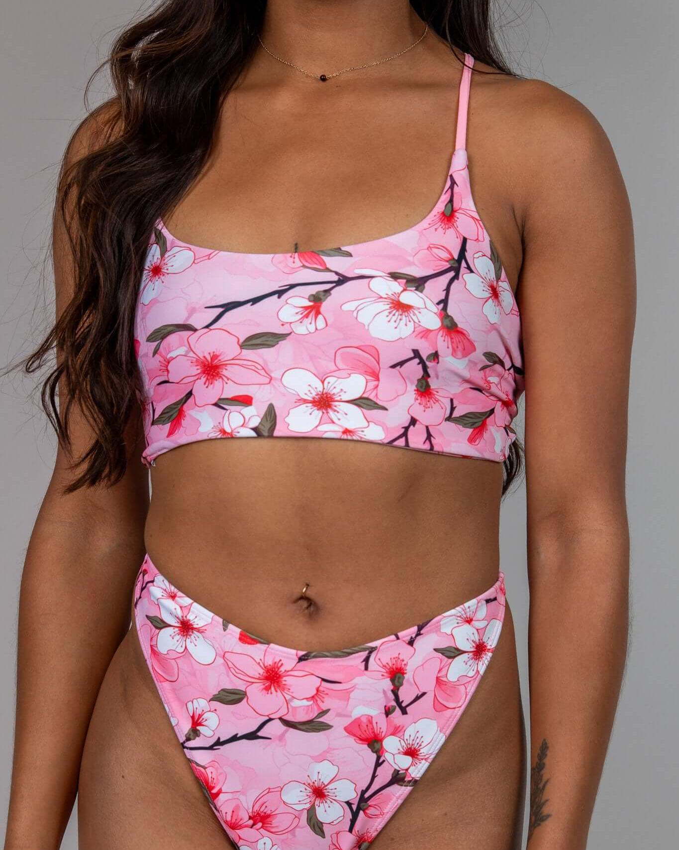 Pink cherry blossom bikini set, perfect for summer beachwear and festival outfits, featuring a floral design.