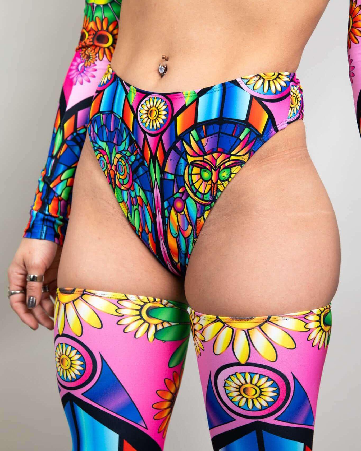 High-waisted neon thong with owl and flower print, perfect for rave outfits and festival fashion.