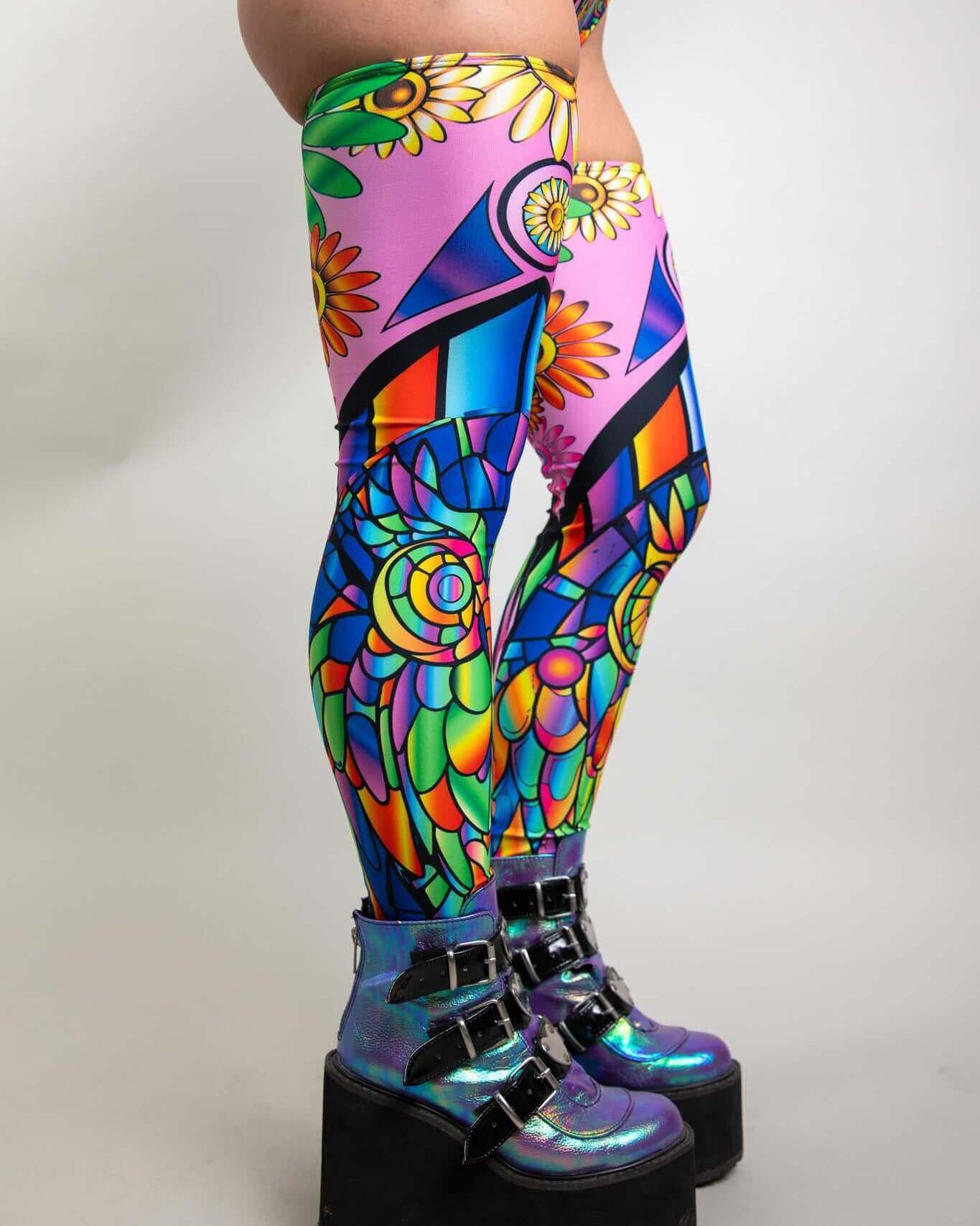 Vibrant psychedelic leg sleeves featuring floral and geometric designs, perfect for rave outfits and bold fashion statements.