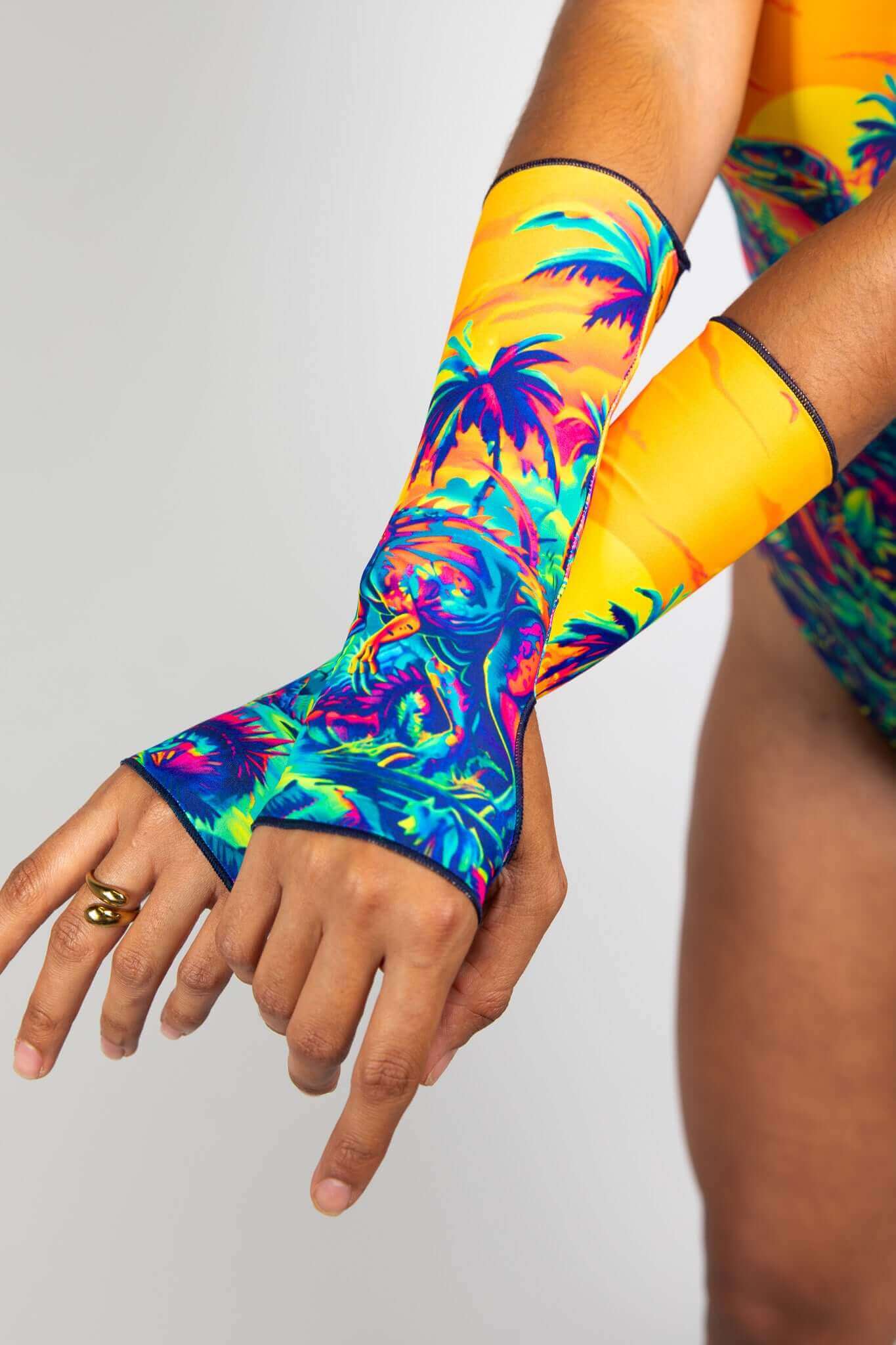 dinosaur print arm sleeves from Freedom Rave Wear for a dinosaur themed rave