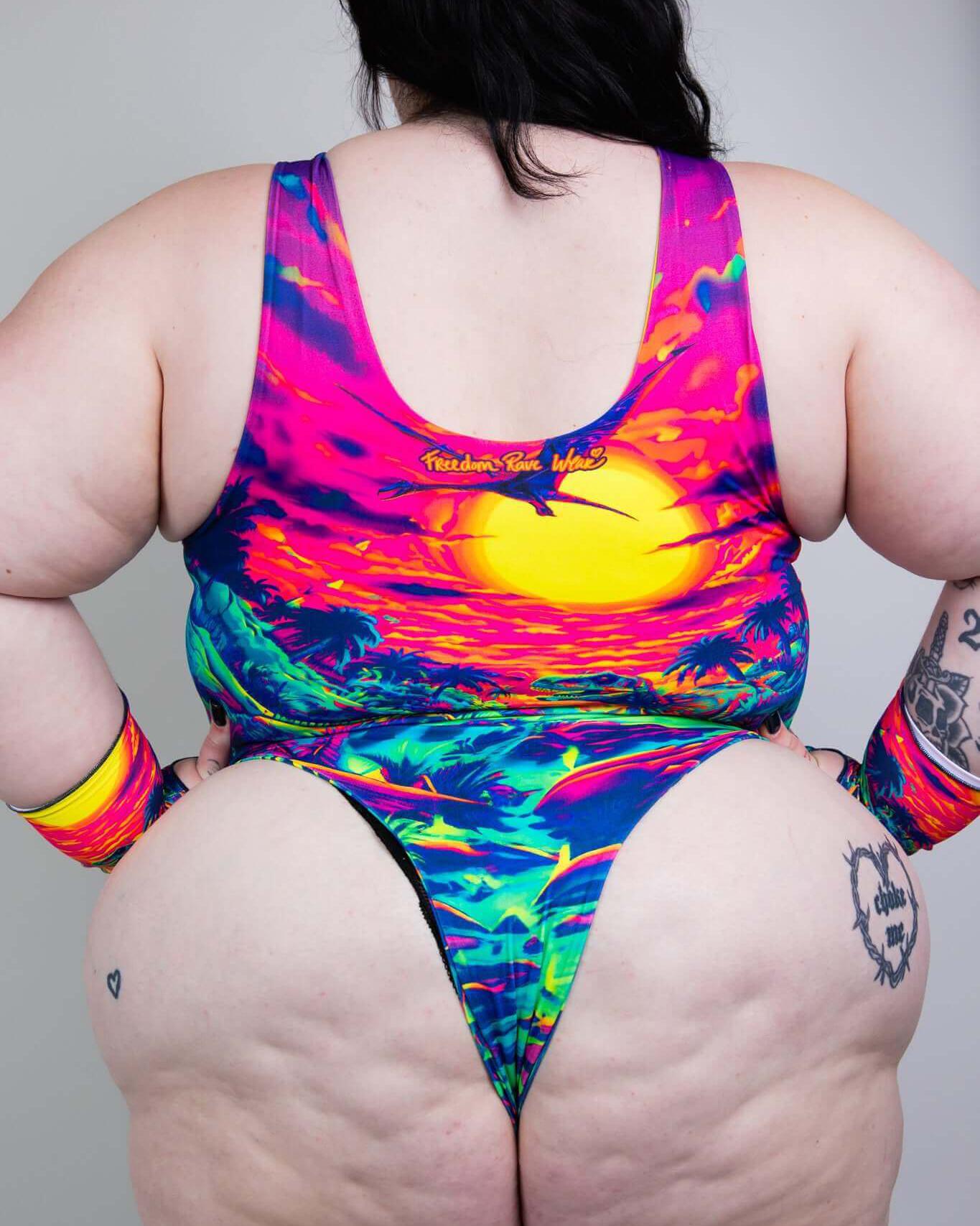 Colorful high-cut swimsuit with sunset design, showcasing vibrant colors and tropical vibes, perfect for summer.