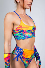 Model showcases the colorful Saurian Reversible Lush Top, perfect for rave outfits and tropical party vibes.