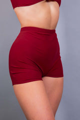 Freedom Rave Wear presents snug high-waisted red rave shorts, perfect for any dance floor ensemble.