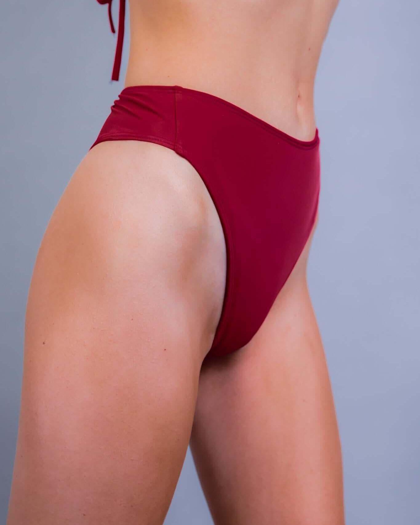 Scarlet high waisted thong showcasing a cheeky cut and soft material, perfect for rave outfits and beach wear.