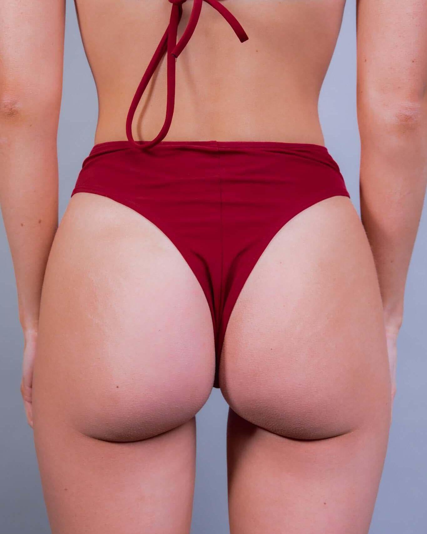 Scarlet high waisted thong showcasing a cheeky cut, perfect for rave outfits and summer fun.