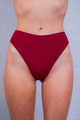 Close-up of a red high-waist rave bottom from Freedom Rave Wear, perfect for stylish festival goers.
