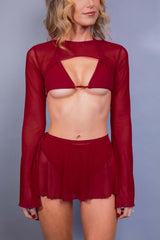 Freedom Rave Wear presents a red rave ensemble featuring a strappy bra top and sheer mesh flare sleeves, paired with a short flowing rave skirt, perfect for stylish rave attire.