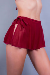 Side view of a sheer scarlet skirt with side tie, part of Freedom Rave Wear's rave-ready outfits.