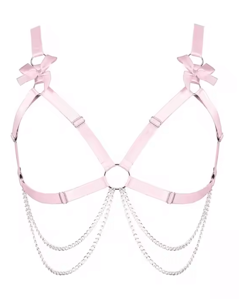 Heartthrob Harness in light pink with bows and chain detailing, perfect for bold rave outfits.