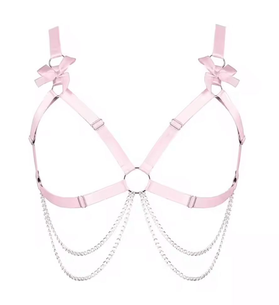 Heartthrob Harness in light pink with bows and chain detailing, perfect for bold rave outfits.