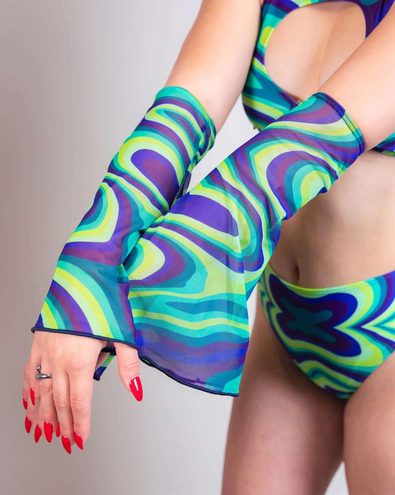 Seaglass spiral mesh flare sleeves in vibrant blue and green patterns, styled with a matching bikini for rave outfits.