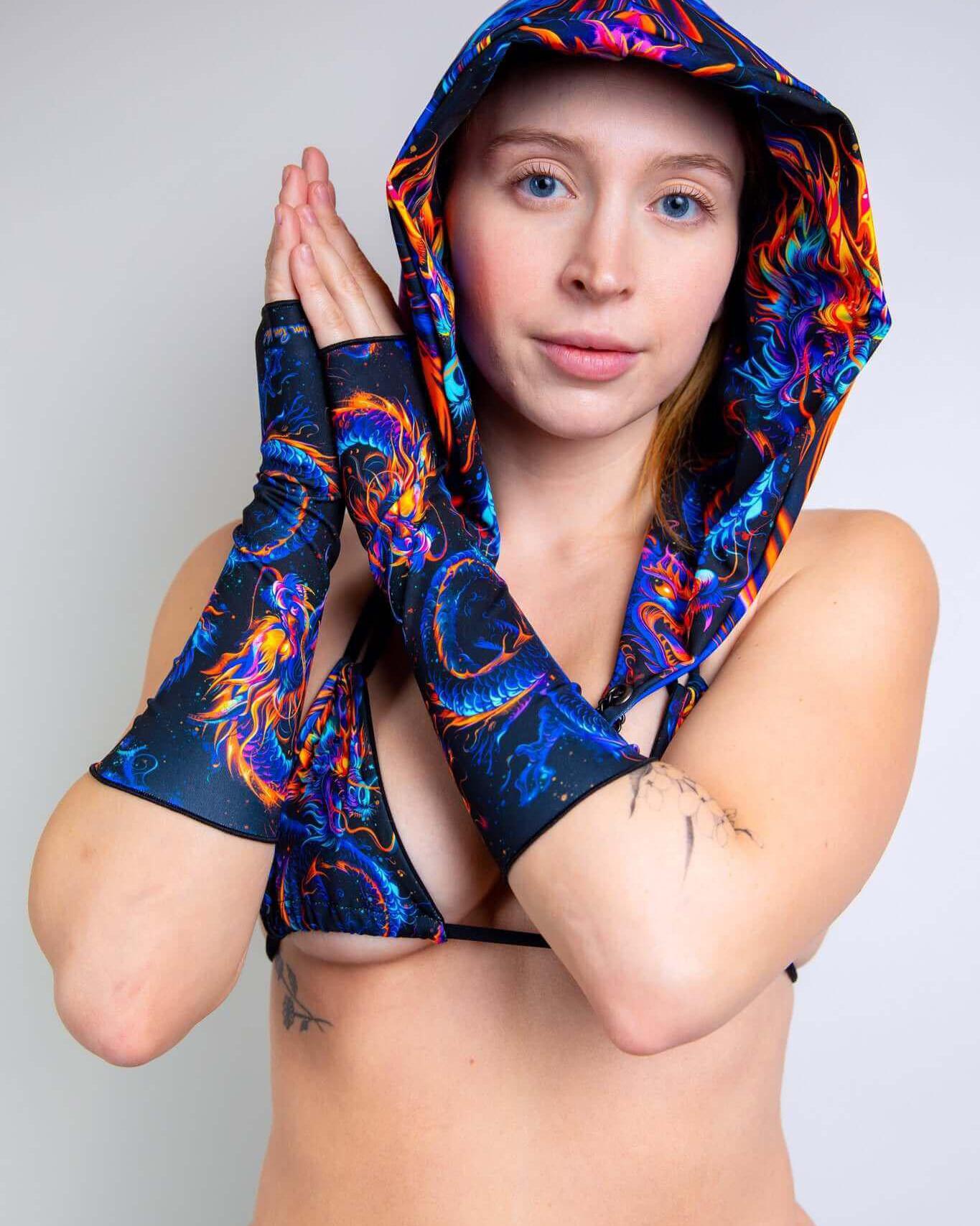 Model wearing vibrant ShadowFlame Gloves and matching hood, perfect for rave outfits and expressing unique style.