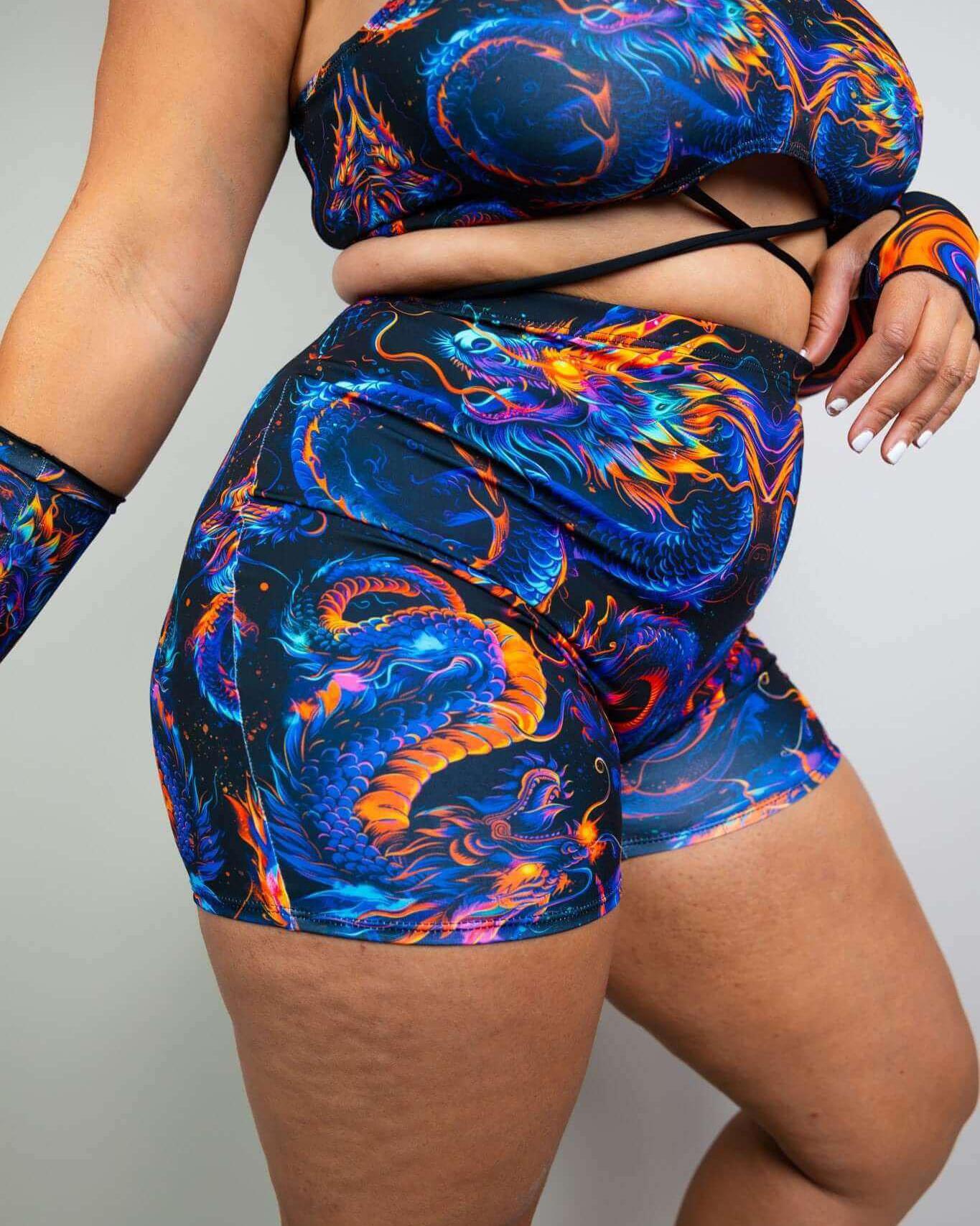 Model showcasing ShadowFlame High Waist Shorts, vibrant colors, perfect for rave outfits with full coverage and comfort.