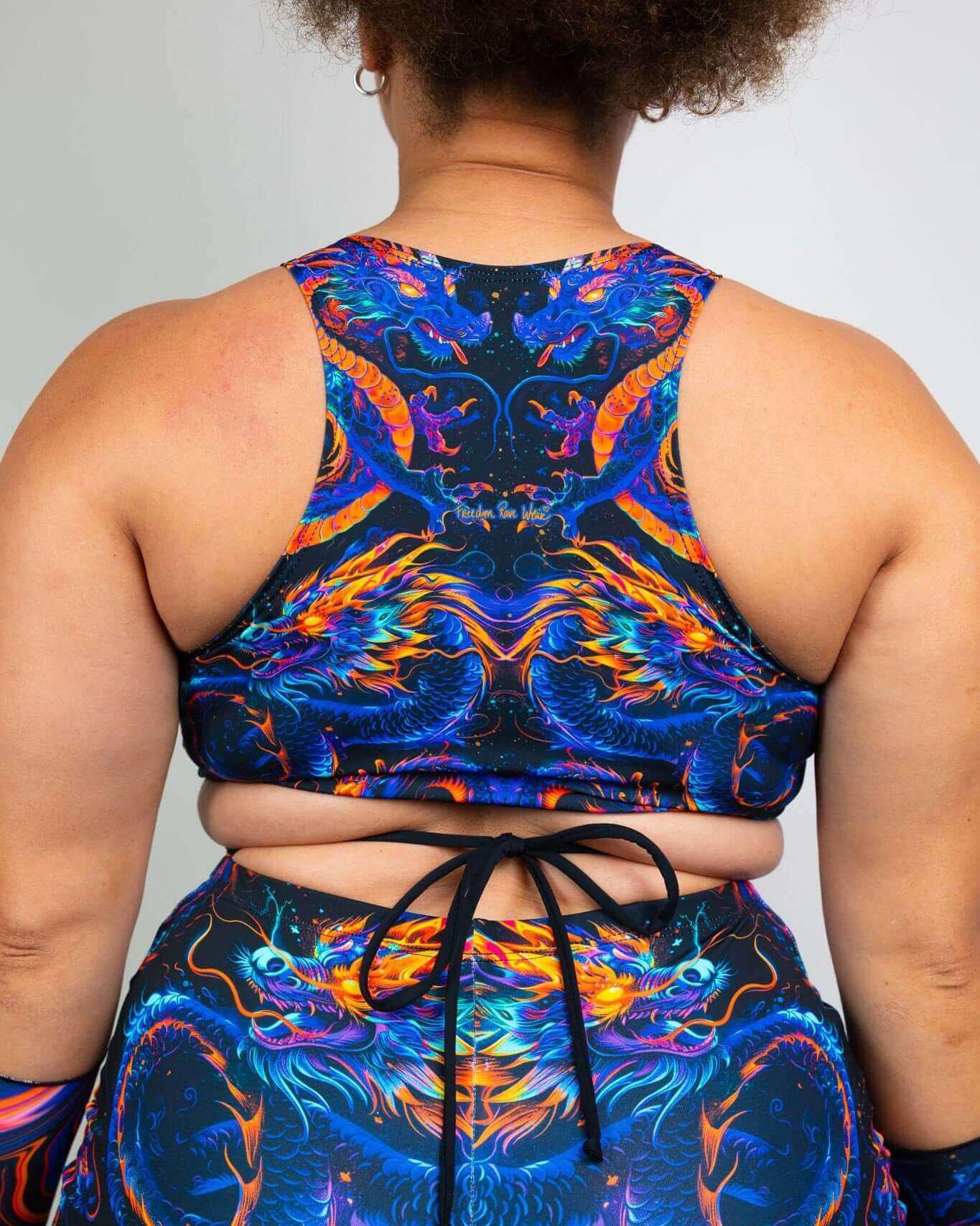 Back view of ShadowFlame Teaser Top featuring vibrant dragon design and crisscross straps, perfect for rave outfits.