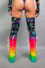  Back view of Freedom Rave Wear set featuring vibrant leg wraps with psychedelic patterns, paired with bold ombré platform boots with zipper details.