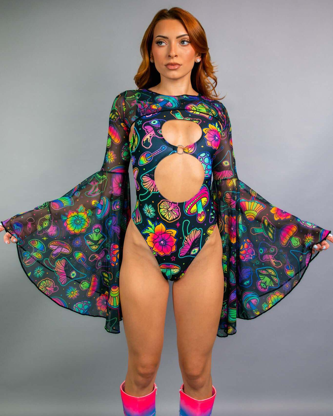 Model showcasing Shroomie! Mesh Bell Sleeves rave outfit, featuring vibrant colors and a dramatic design.