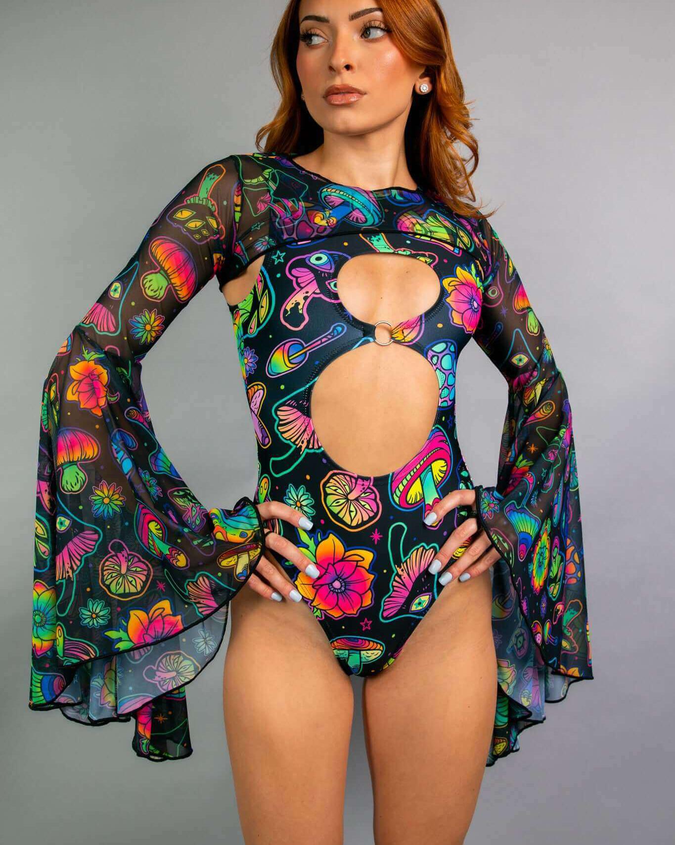 Model showcasing Shroomie! Mesh Bell Sleeves bodysuit, perfect for vibrant rave outfits with floral and psychedelic prints.