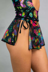 Colorful Shroomie! Mesh Swirl Skirt tied at the waist, perfect for rave outfits and adding flair to festival fashion.