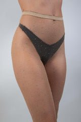 Small diamond rhinestone fishnet stockings in nude, perfect accessory for rave outfits and night outs.