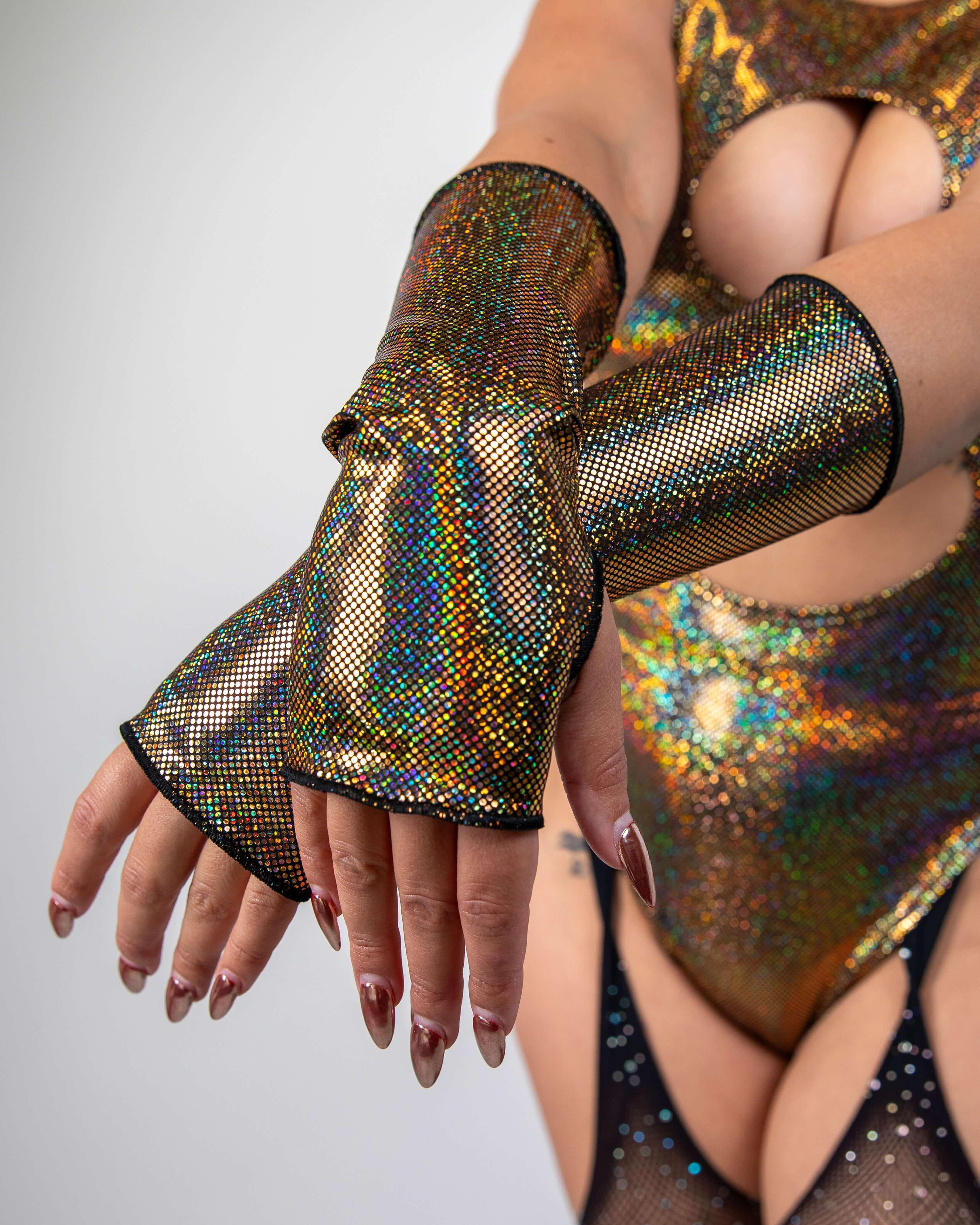 Sparkly gold Starfire Gloves with thumb holes, perfect for rave outfits and stylish events.