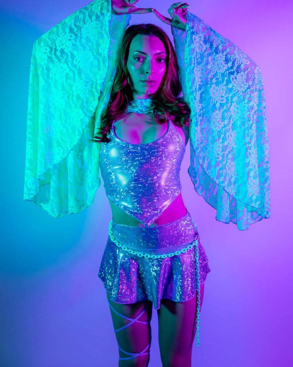 Model wearing Calypso Lace Bell Sleeves with a sparkly outfit, perfect for rave outfits and festival dancing.