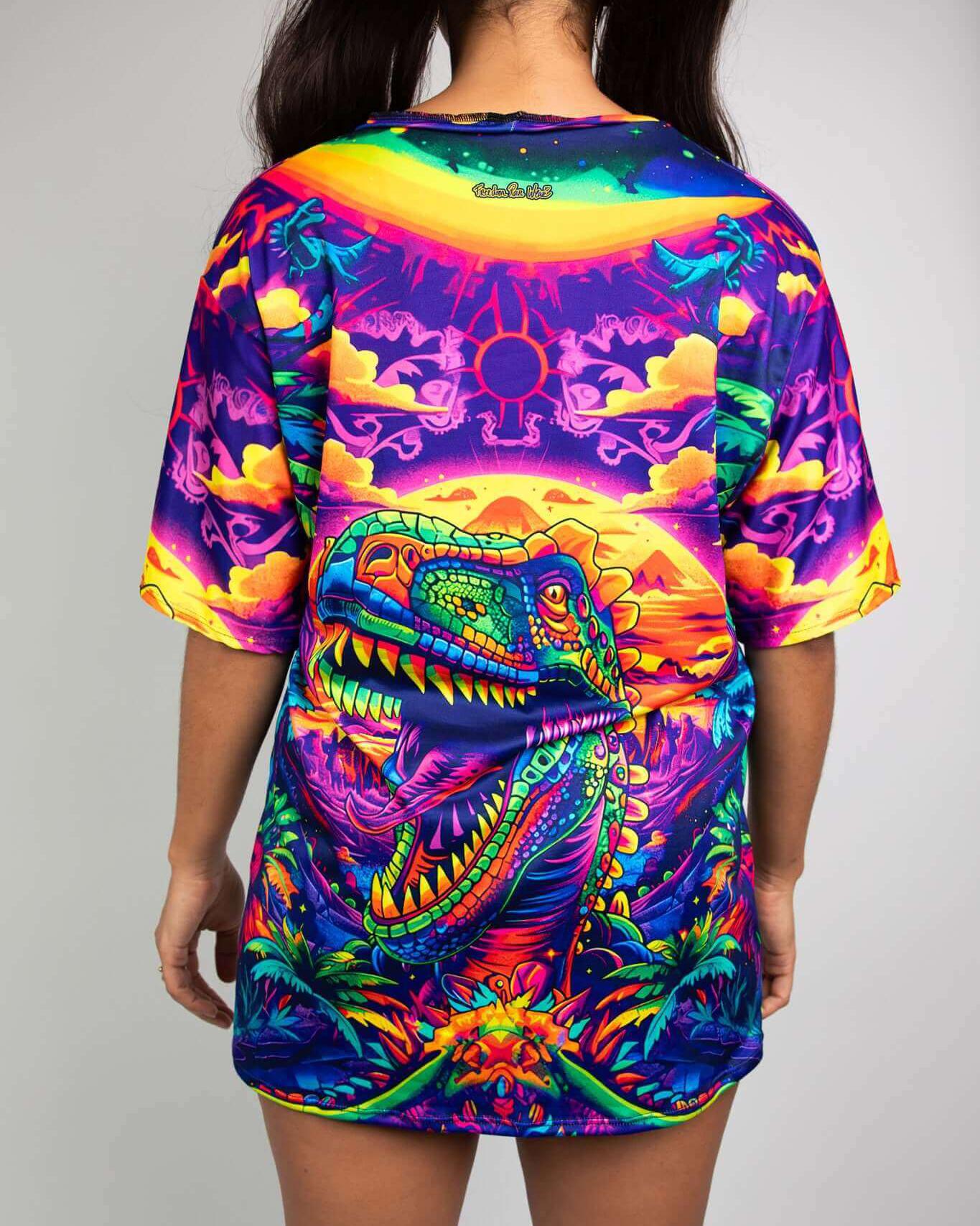 Model showcasing the vibrant Titan Oversized Softee t-shirt with a bold T-Rex graphic, perfect for rave outfits.