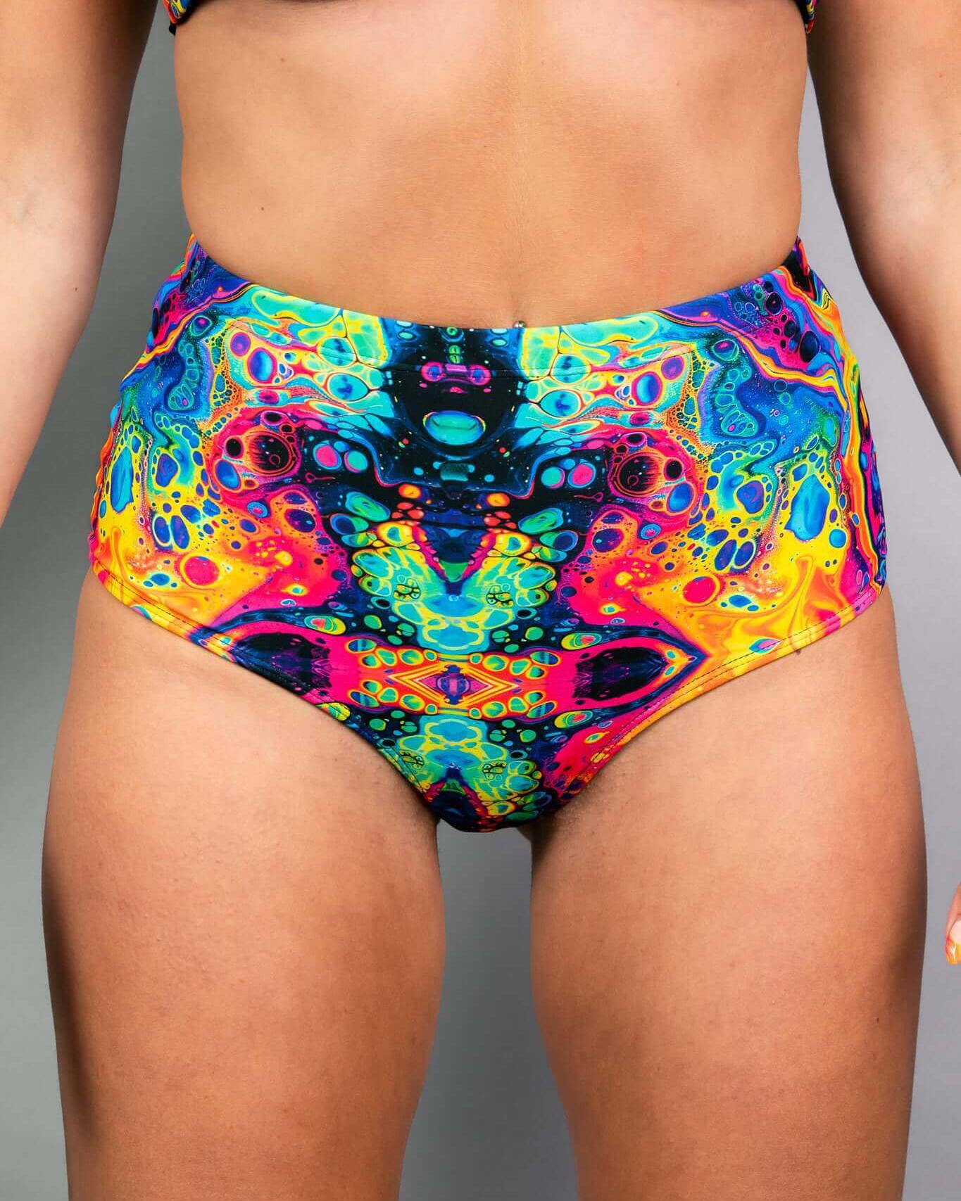 Vivid high waisted bottoms in colorful psychedelic design, perfect for rave outfits and added hip coverage.