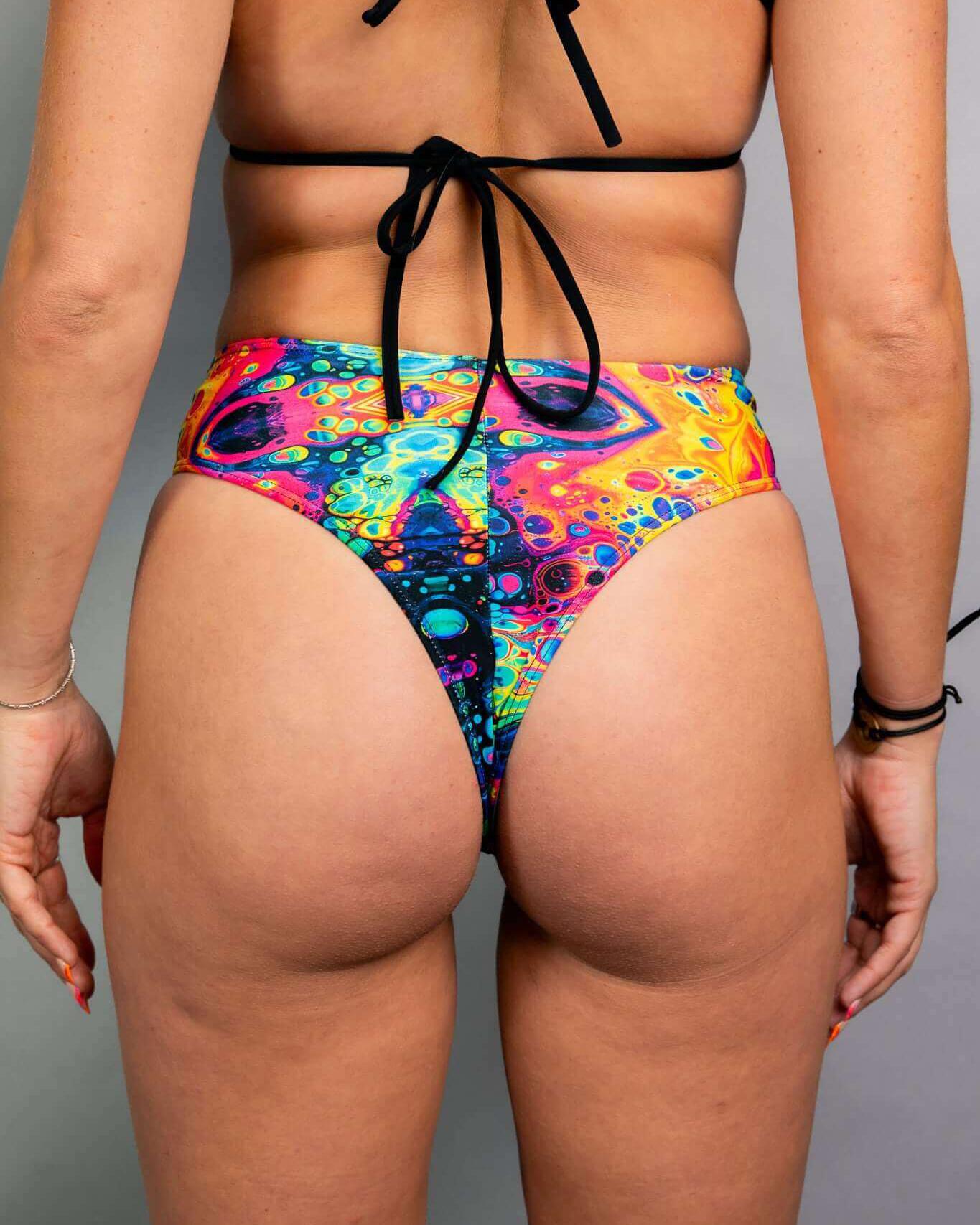 Vivid high waisted thong showcasing a trippy rainbow design, ideal for rave outfits and comfortable fit.