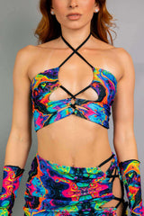 Front view of Freedom Rave Wear's psychedelic crop top featuring a crisscross halter design and vibrant, bold print perfect for festivals.