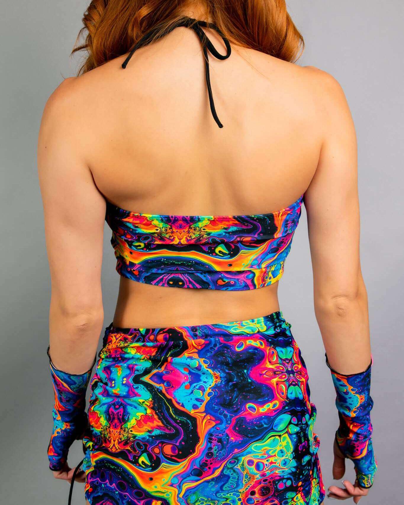 Vivid Ibiza Top showcasing a colorful trippy rainbow print, perfect for rave outfits. Comfort meets style for dancers.