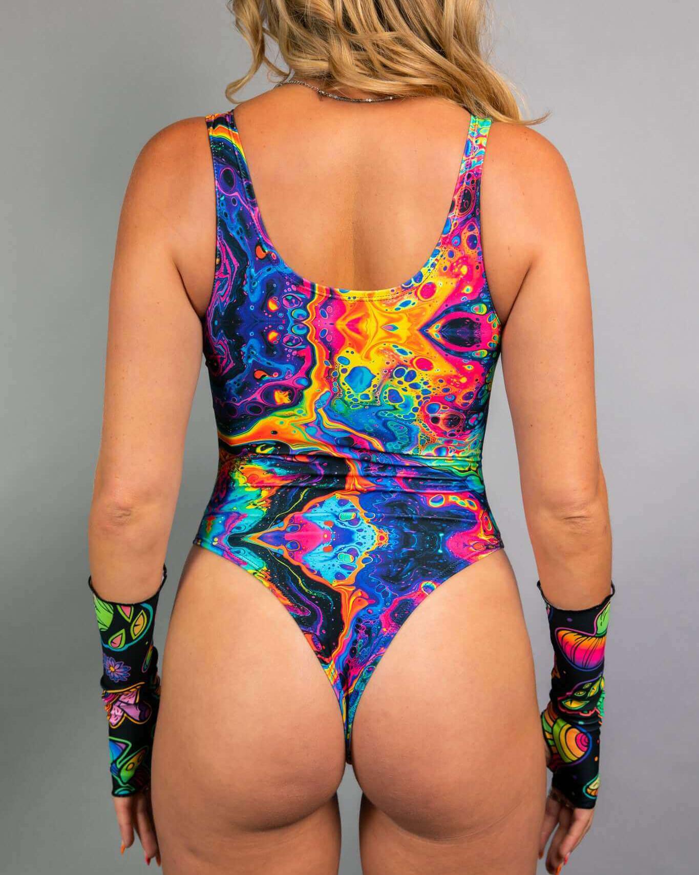 Vivid Keyhole Bodysuit in vibrant colors, showcasing cutouts and a high hip design, perfect for rave outfits.