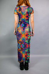 The back view of a form-fitting, psychedelic print dress from Freedom Rave Wear. Vibrant colors and patterns make it perfect for rave events.