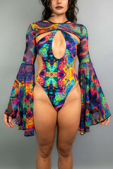 Model showcases Freedom Rave Wear bodysuit featuring a keyhole front, sheer bell sleeves, and psychedelic pattern perfect for rave and festival looks.