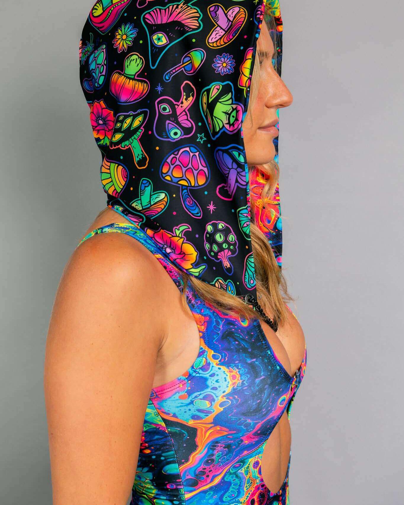 Vivid Shroomie! Assassin Hood displayed, featuring colorful mushroom print, perfect for rave outfits and festivals.