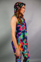 Side view of a model wearing a Freedom Rave Wear matching set with a hooded top and leggings, featuring a vibrant psychedelic pattern. Perfect for bold rave looks.