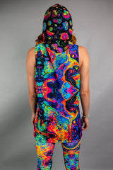 Back view of a model wearing a Freedom Rave Wear hooded top and leggings, both featuring a vibrant psychedelic pattern. Perfect for bold rave outfits.