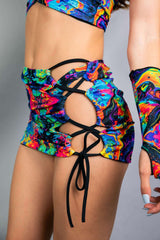 Vivid Verano Mini Skirt with vibrant rainbow trippy print and lace-up design, perfect for rave outfits.