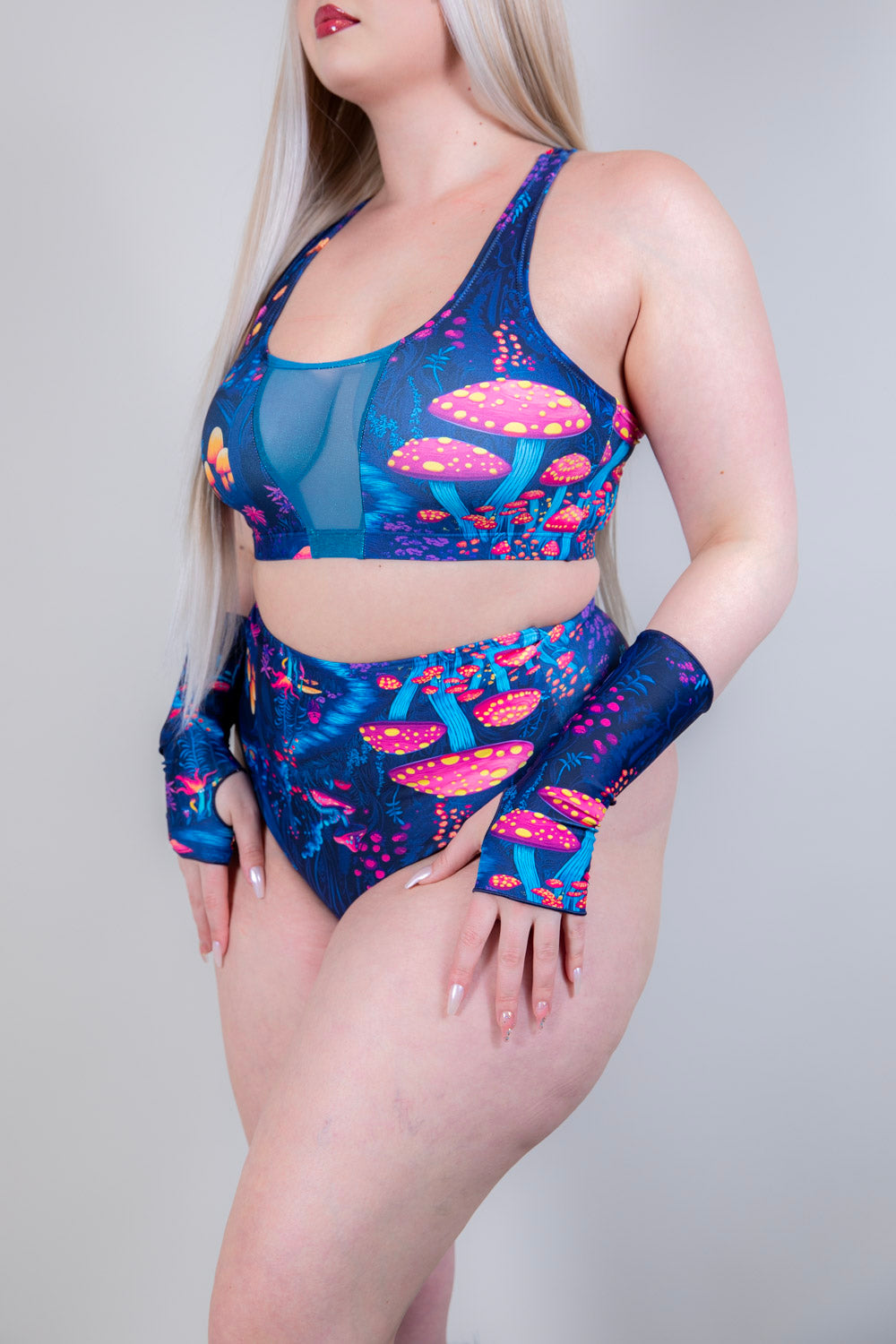 Model posing in the Wildwood V Free Top with matching bottoms, emphasizing the vibrant festival print.