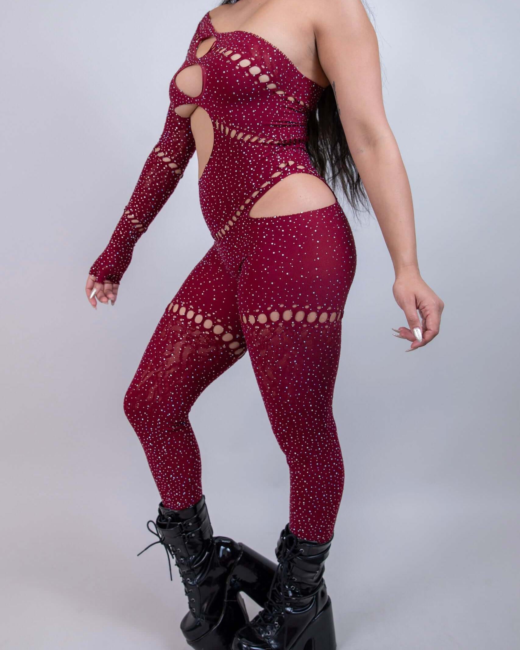 Burgundy asymmetrical rhinestone jumpsuit with cutouts, perfect for rave outfits and bold fashion statements.