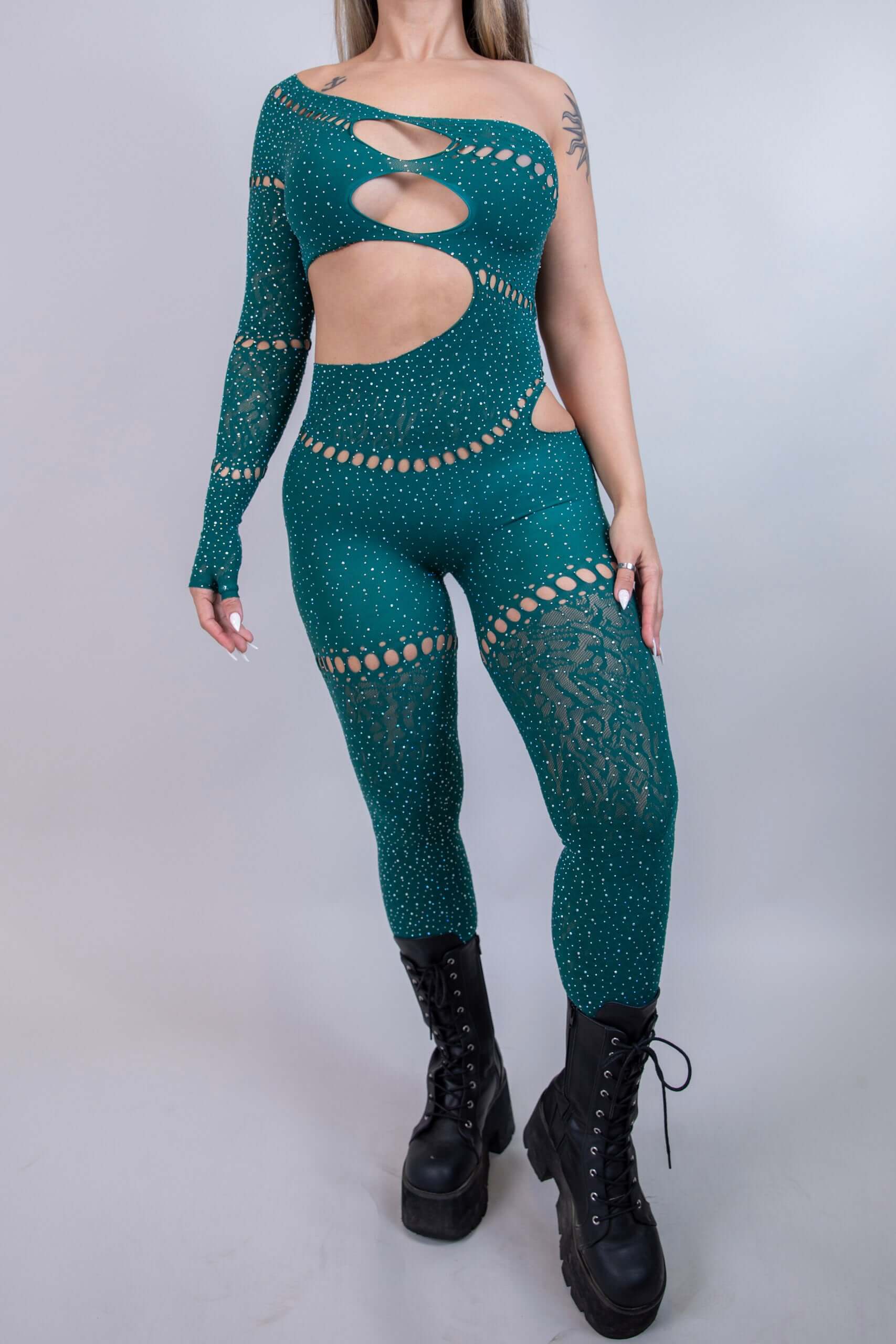 Emerald asymmetrical rhinestone jumpsuit with cutouts, perfect for rave outfits and bold fashion statements.