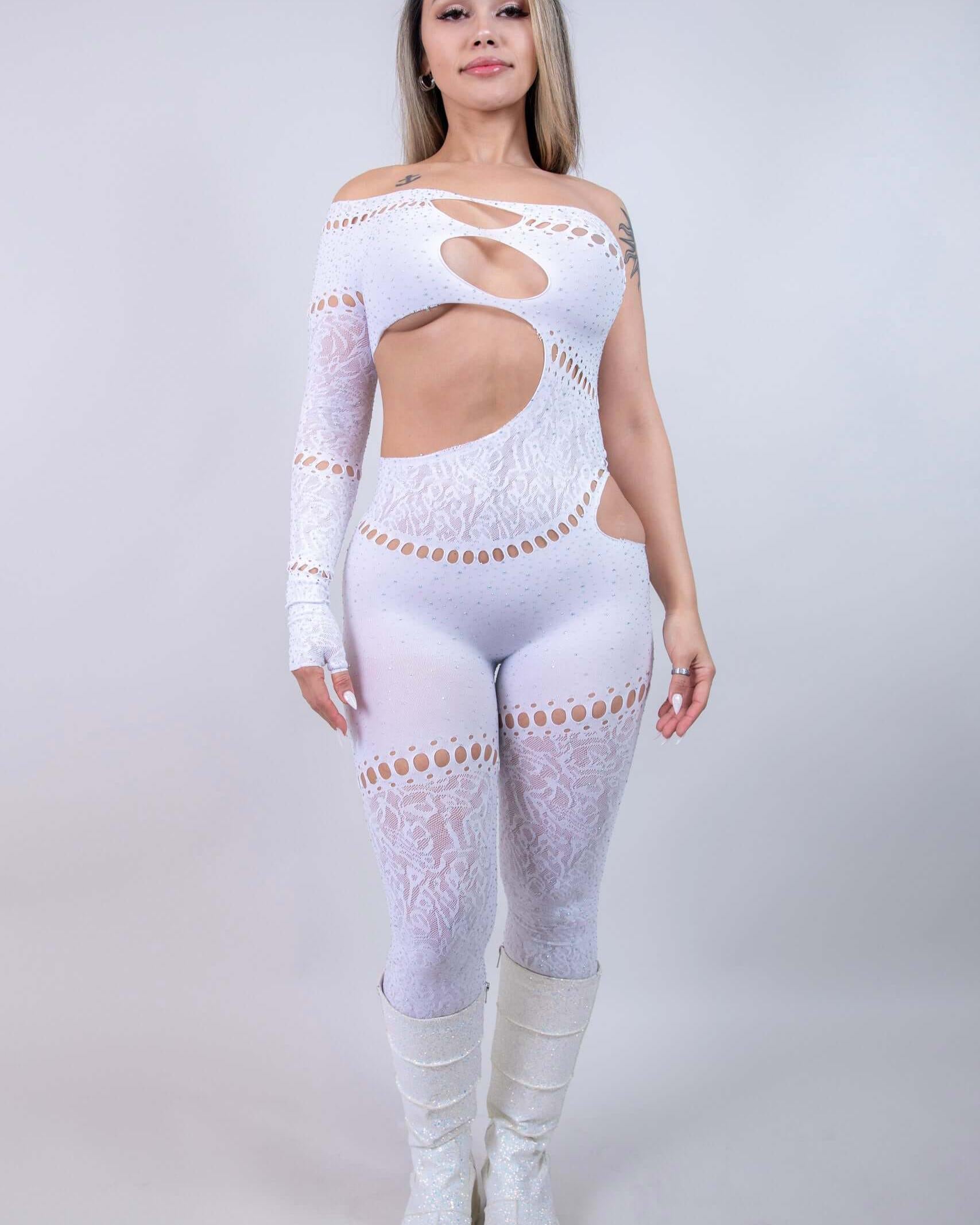 model in The Zoe Asymmetrical Rhinestone Jumpsuit, showcasing cutouts and rhinestones, perfect for rave outfits.