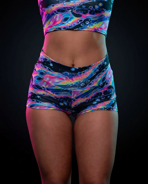 Acid Sky Spandex Shorts front view, featuring vibrant multi-color psychedelic pattern, perfect for rave festivals