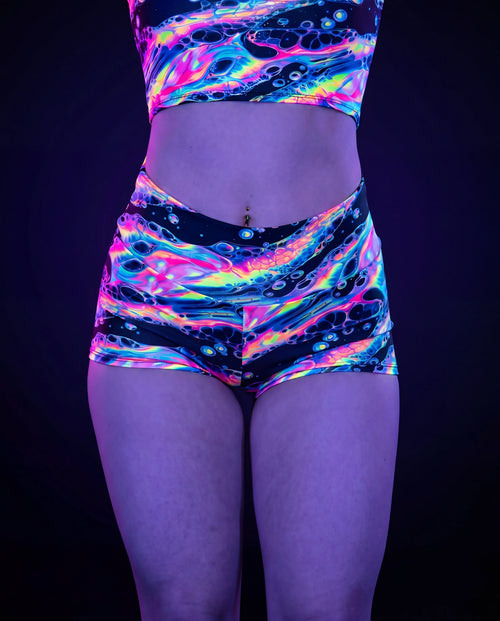 Acid Sky Spandex Shorts front view, featuring vibrant multi-color psychedelic pattern, perfect for rave festivals — UV blacklight